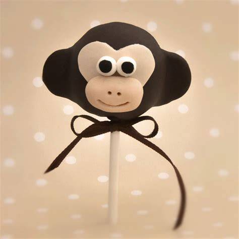 Affen-Cake Pops und Fondant-Affe auf Torte