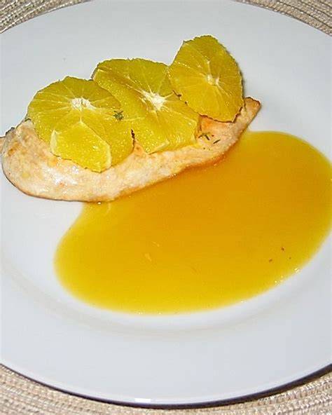 Anrichten am Serviertag: Nocken mit Orangensauce und Zesten