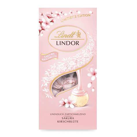 Ansicht der Lindt Erdbeer‑Sahne Kugeln: geöffnete Kugel mit rosa Füllung