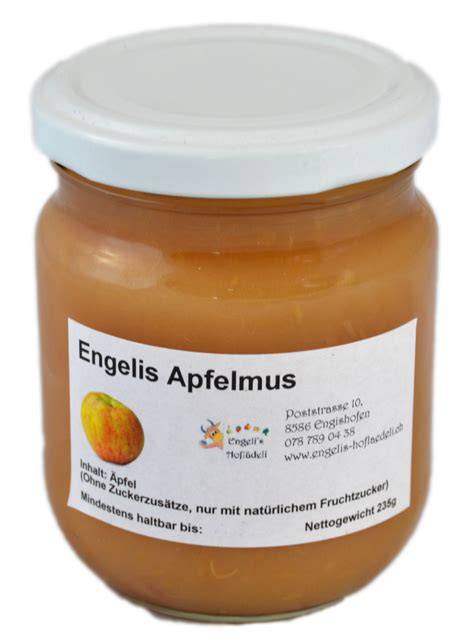 Apfelmus im Glas und frische Äpfel