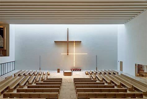 Architektur: Moderne Hülle von Christ & Gantenbein neben historischem Fabrikgebäude