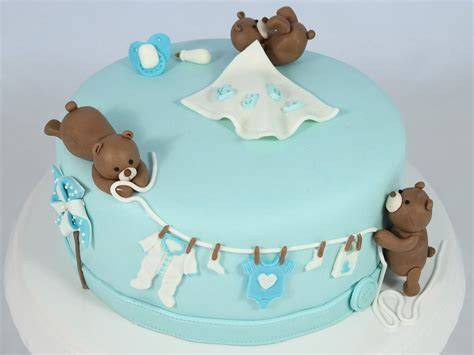 Babyshower Torte mit Babyschühchen und Wolken