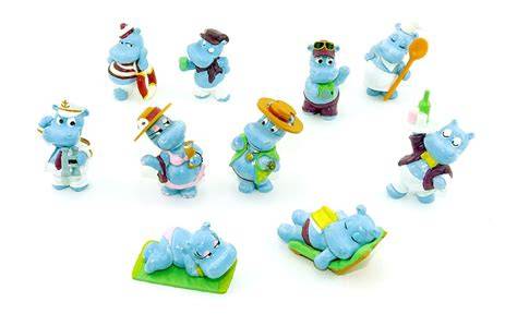 Beispielhafte Ü-Ei Figurenserien (Happy Hippos, Schlumpf-Serie)