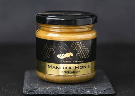 Bild: Glas Manuka-Honig und Manuka-Blüten