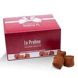 Bild: Nahaufnahme der 5 Nougat-Auslese Pralinen in edler Verpackung