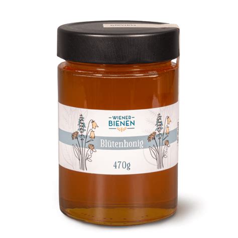 Blütenhonig in Wabenzellen mit Bienen