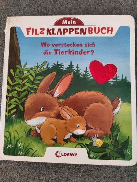 Cover des Fühlbuchs und geöffnete Seite mit Filzklappen