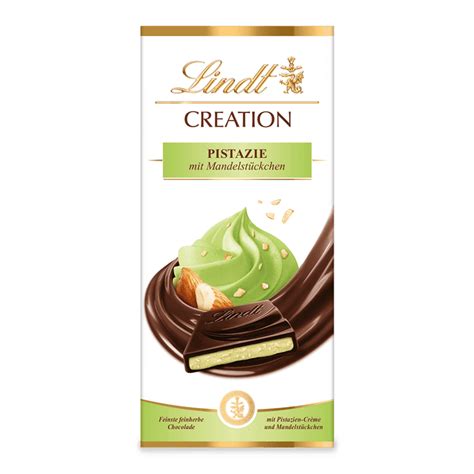 Detailaufnahme der Tafel Lindt Creation Pistazie mit Mandelstückchen, Schichten und Nussstücke