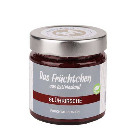 Ein Glas hausgemachter Fruchtaufstrich mit Löffel