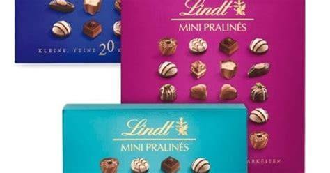 Elegante Packung Lindt Mini Pralinés 9 Stück mit aufgeschnittener Praline