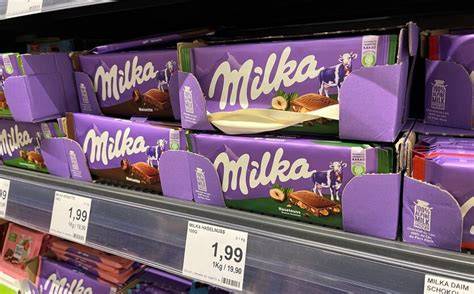 Farbige Banderolen zur Sortenerkennung auf Milka Verpackungen