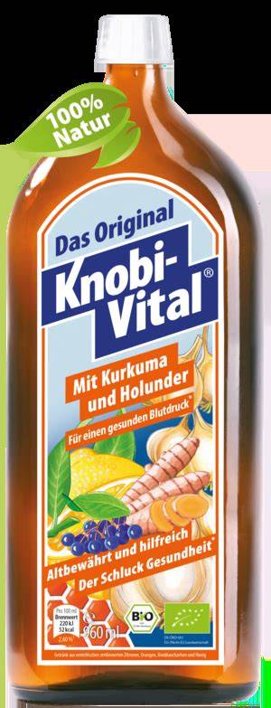 Flasche KnobiVital und frische Bio-Zutaten (Knoblauch, Zitronen, Orangen)