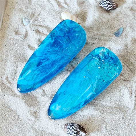 Fondant-Flosse in Marmoroptik und Muscheln