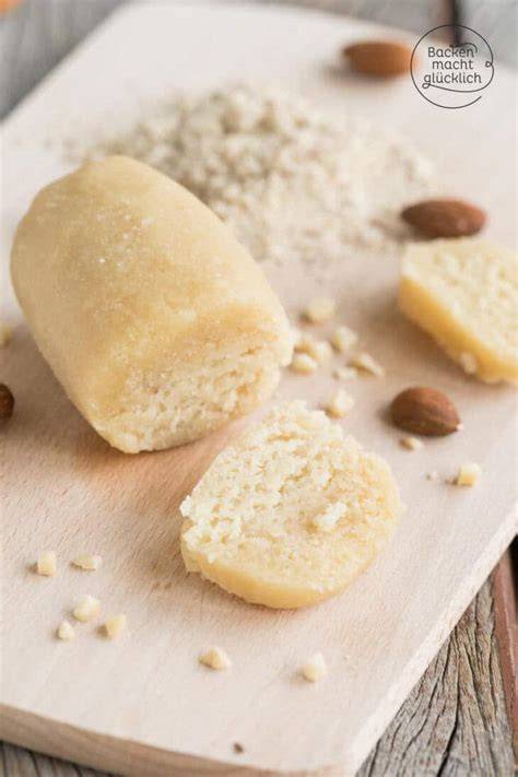 Frische Marzipanrohmasse, Mandeln und Puderzucker