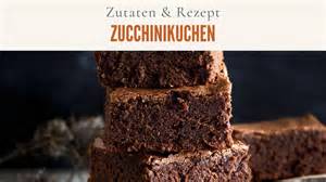 Geraffelte Zucchini und Zutaten für einen Schokoladenkuchen nebeneinander dargestellt