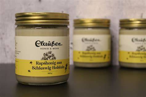 Gläser mit Rapshonig und Frühjahrsblütenhonig