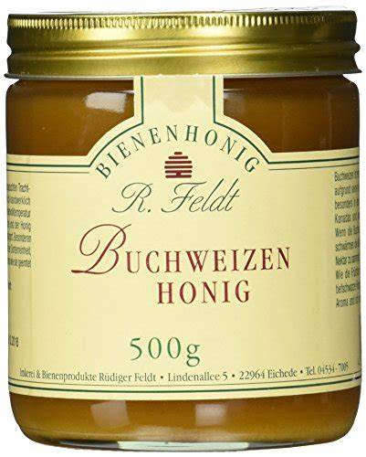 Gläser mit dunkelbraunem Buchweizenhonig als Delikatesse