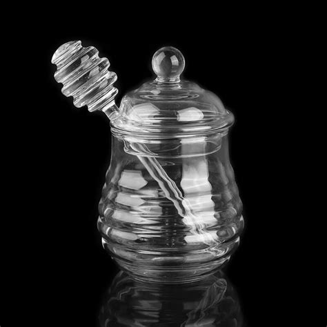 Glas mit Honig und Löffel