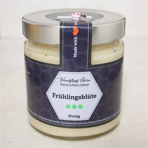 Glas mit flüssigem und cremigem Honig