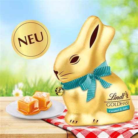Gold eingewickelter Lindt Goldhase mit grüner Schleife