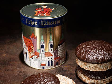 Goldene Schmuckdose mit historischen Nürnberg-Motiven und Lebkuchen