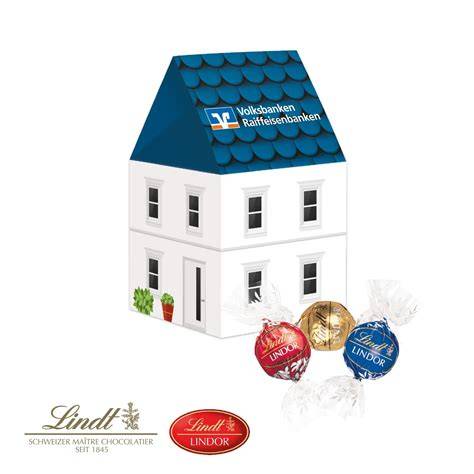 Goldenes Präsent mit Lindt Lindor-Pralinés in Pyramidenverpackung