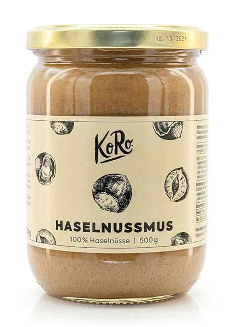 Haselnüsse, Honigglas und Brotaufstrich