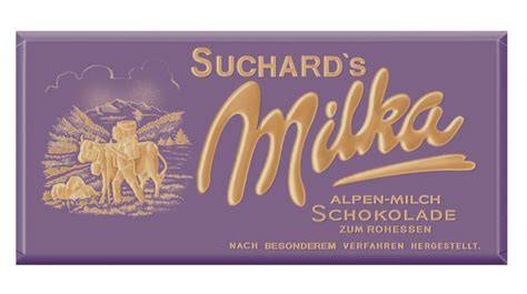 Historische Milka-Verpackungen in Lila mit Alpenkuh