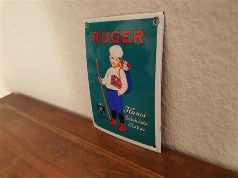 Historische Werbung und Verpackungen der Ruger Schokolade mit „Hansi“