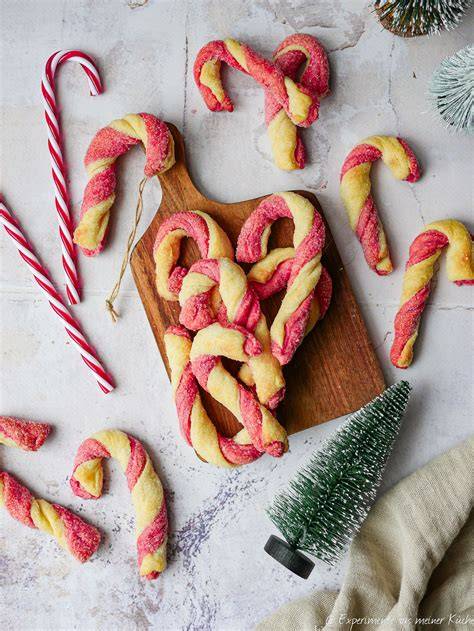 Infografik zu internationalen Weihnachts-Traditionen mit Zuckerstangen