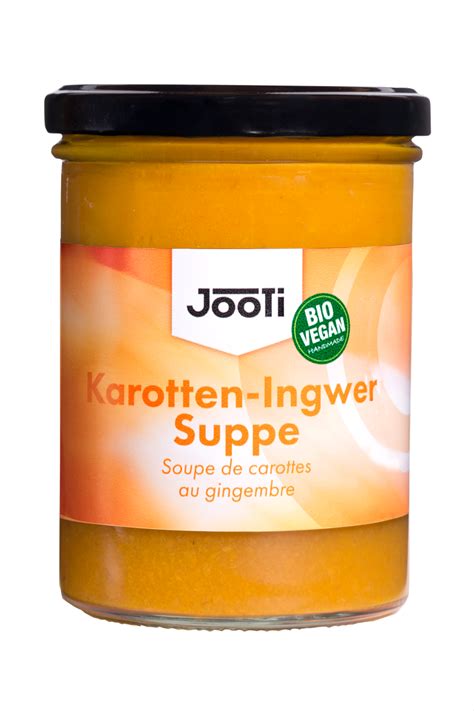 Kaki-Orangen-Konfitüre im Glas, Ingwer daneben