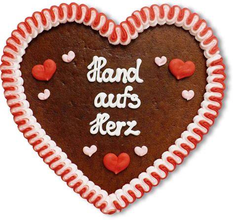 Lebkuchenhaus und verzierte Lebkuchenherzen