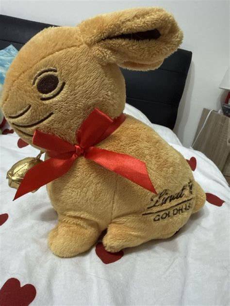 Lindt GOLDHASE in Goldfolie mit roter Schleife