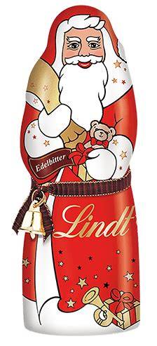 Lindt Weihnachtsmann als Geschenk auf einem gedeckten Tisch