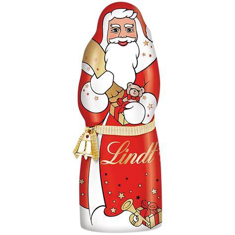 Lindt Weihnachtsmann in rot-goldener Folie auf Weihnachtsteller