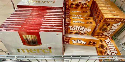 Logo Storck und Edeka, sowie einige Produkte aus dem Sortiment (Toffifee, Merci, Nimm 2)