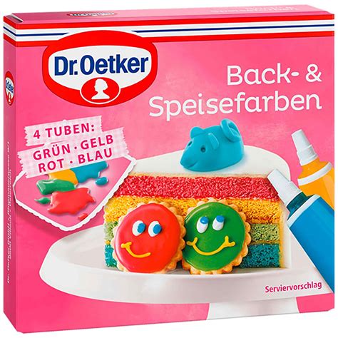 Marzipanrohmasse und bunte Speisefarben auf weißer Arbeitsfläche