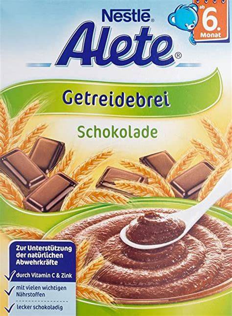 Packung und Schüssel mit zubereitetem Alete Getreidebrei Schokolade