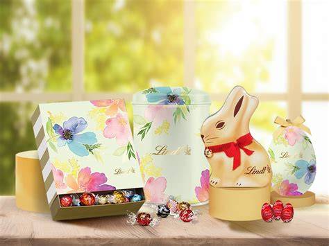Pralinen schön verpackt in Geschenkbox mit Papiermanschetten