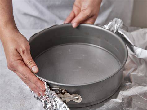 Schema: Wasserbad, Alufolie, Temperaturführung für Cheesecake