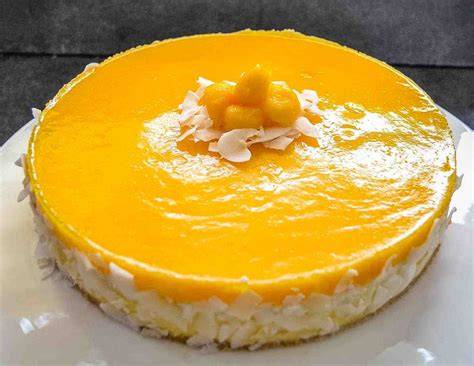 Schnittzeichnung: Aufbau einer Mango Kokos Torte (Boden, Mango, Kokoscreme, Dekoration)