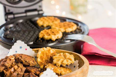 Schrittfolge: Teigkugeln, Waffeleisen, goldene Plätzchen