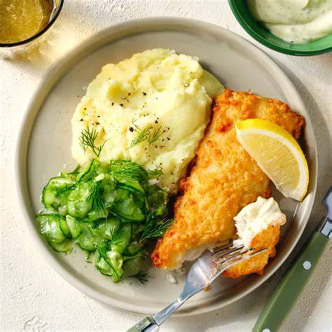 Serviervorschlag: Backfisch mit Honig-Senf-Soße und Dill