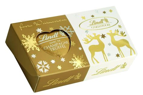 Stimmungsvolle Produktinszenierung Lindt Goldstücke Pralinen in Gold-Weiß