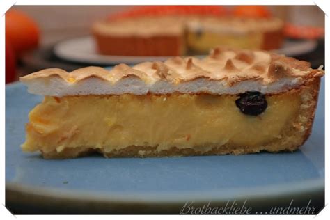 Tarocco-Orangen-Tarte mit Blaubeeren und frisch abgeflämmter Baiserhaube