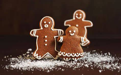Vollmilch Lebkuchen auf Teller mit Zutaten (Mehl, Zucker, Schokolade, Gewürze)