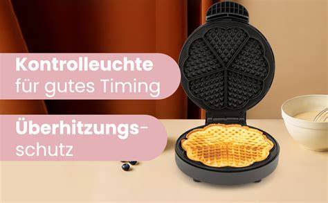 Waffeleisen mit goldbraunen Muschelwaffeln