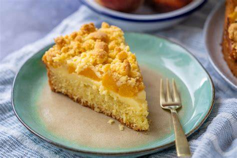 Zubereitungsschritte für einen klassischen Pfirsich-Schmand-Kuchen in Bildern