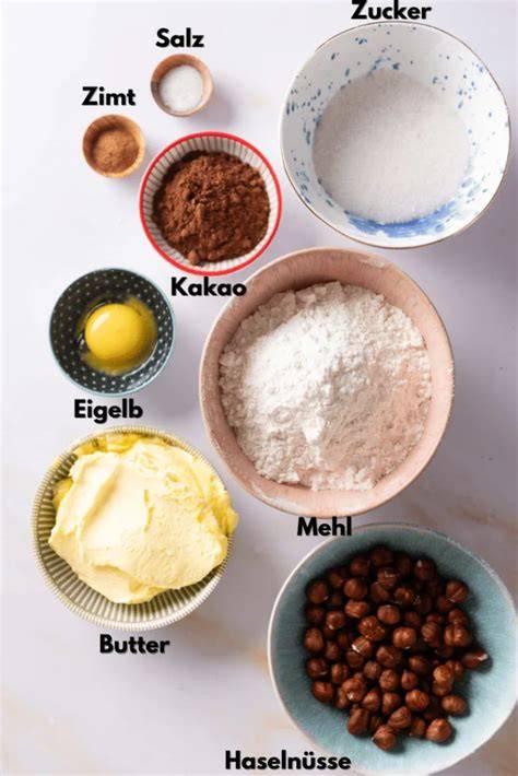 Zutaten für Schoko Linzer Plätzchen: Kakao, Gewürze, Butter, Mehl, Zucker