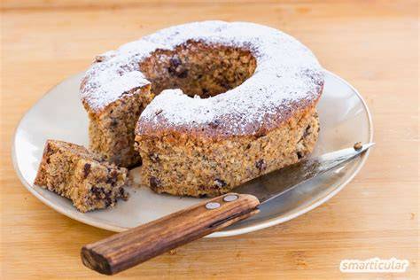 Zutaten für Schoko-Haselnuss-Kuchen ohne Mehl: Schokolade, Haselnüsse, Butter, Zucker, Kakao